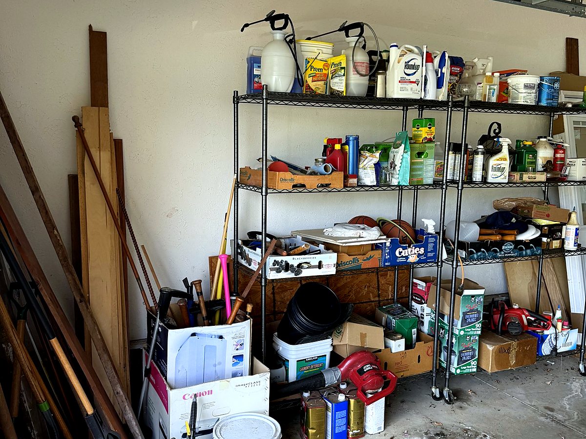 Before — cluttered garage shelves