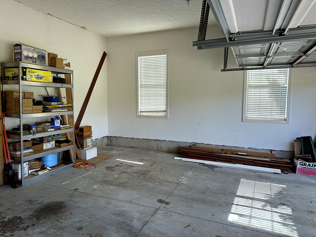 Empty clean garage bay with door open